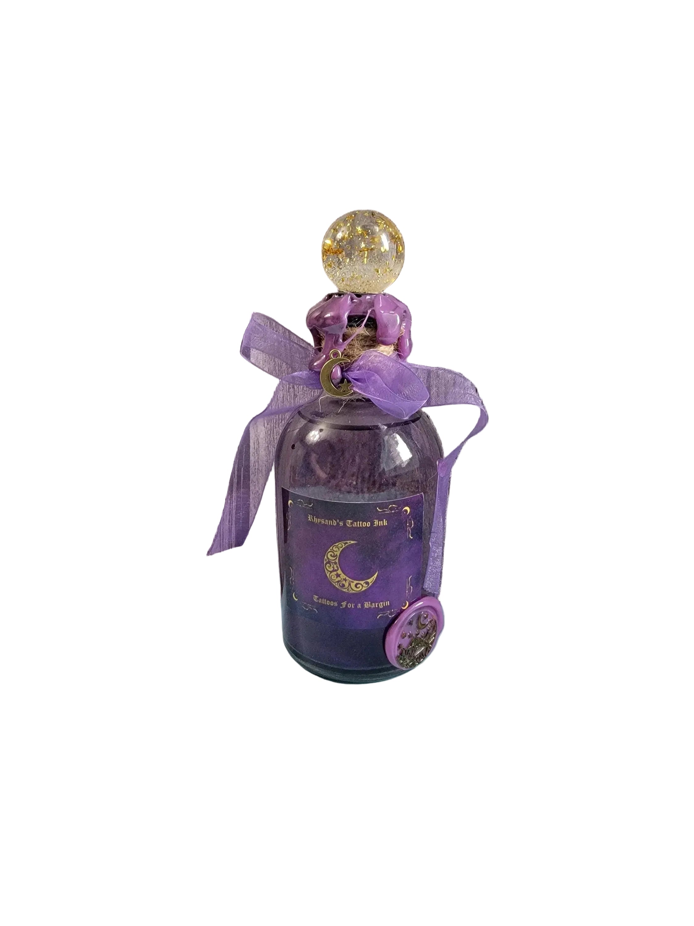 Purple bottle with decorative elements on a wooden surface
