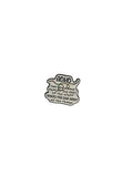 Metallic badge with text on a gray background