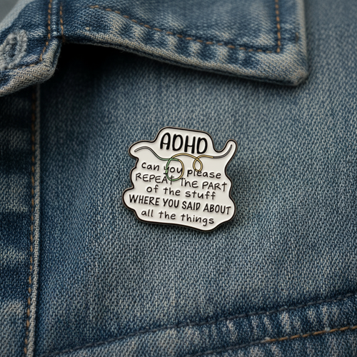 ADHD enamel pin worn on denim jacket lapel, mental health pin style for everyday wear