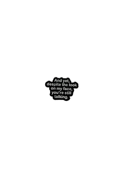 Black and white text pin on a white background