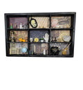 Decorative shelf with various items against a white wall