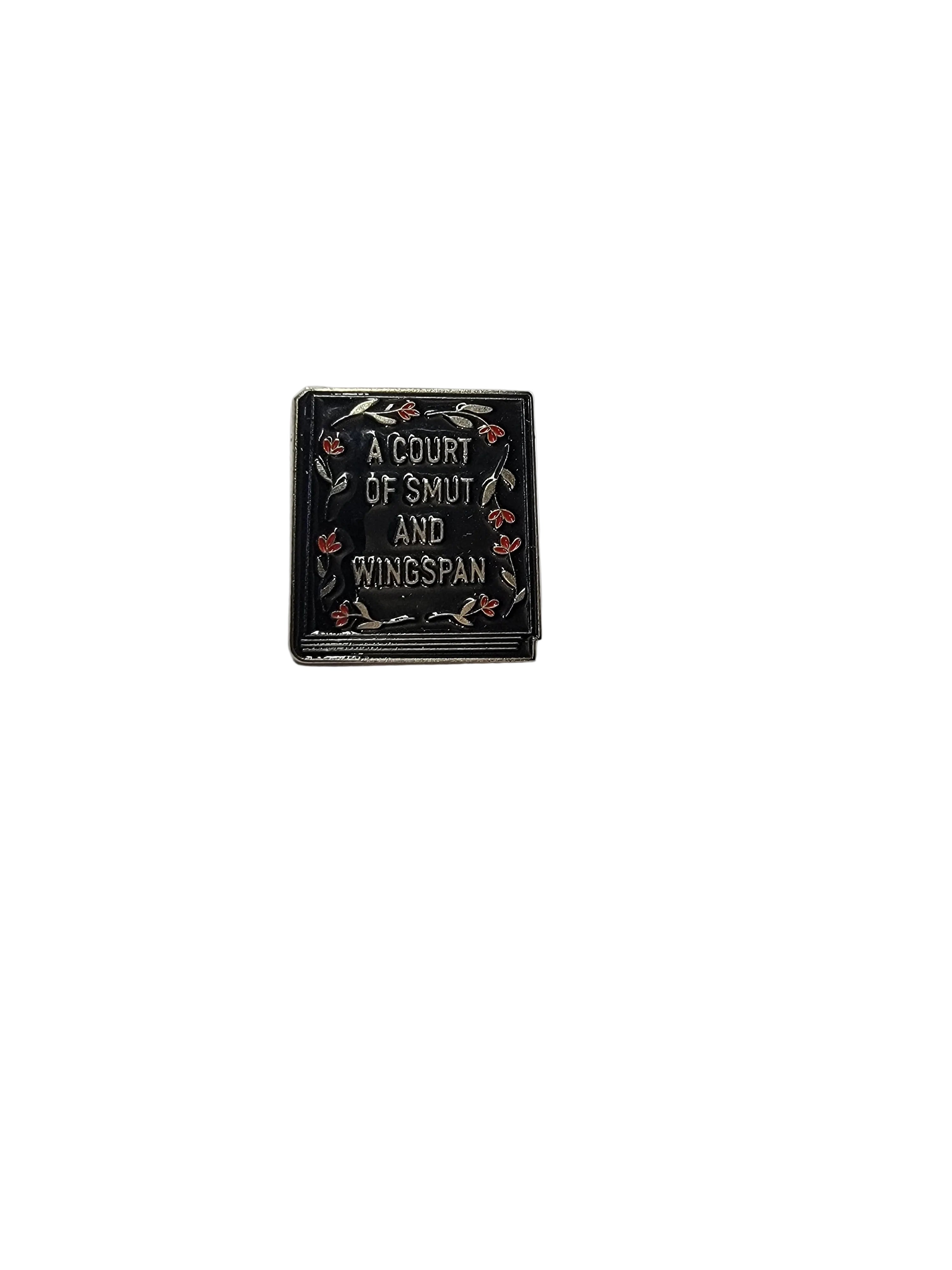 Small rectangular shaped book pin with text and decorative elements on a white background