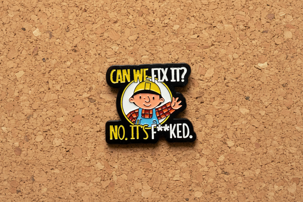 Pin with cartoon character and text on a cork background