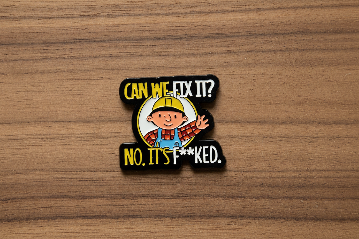 Pin with cartoon character and text on a wood background
