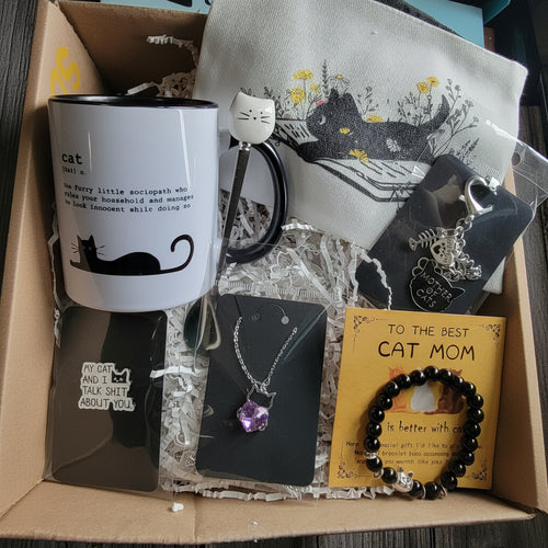 Cat-themed gift set with mug, necklace, and bracelet in a box. Perfect gift for cat  lovers. 