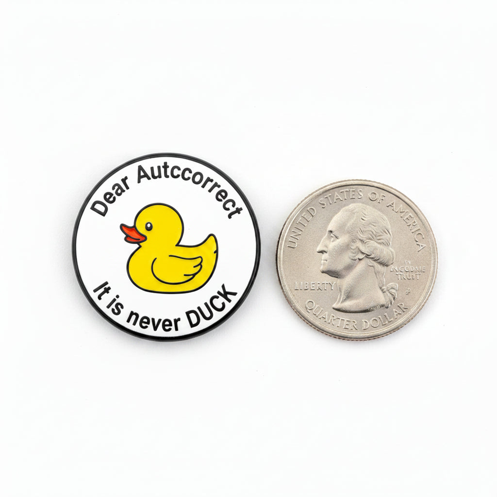 Dear Autocorrect enamel pin shown next to quarter for size reference cute animal enamel pin dims   1 1/8 in W x 1 1/8 in H