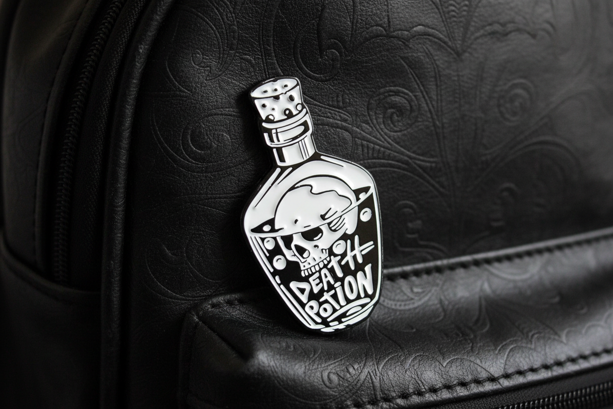 Death Potion enamel pin attached to bookbag alternative style accessory for customizing bags and school gear