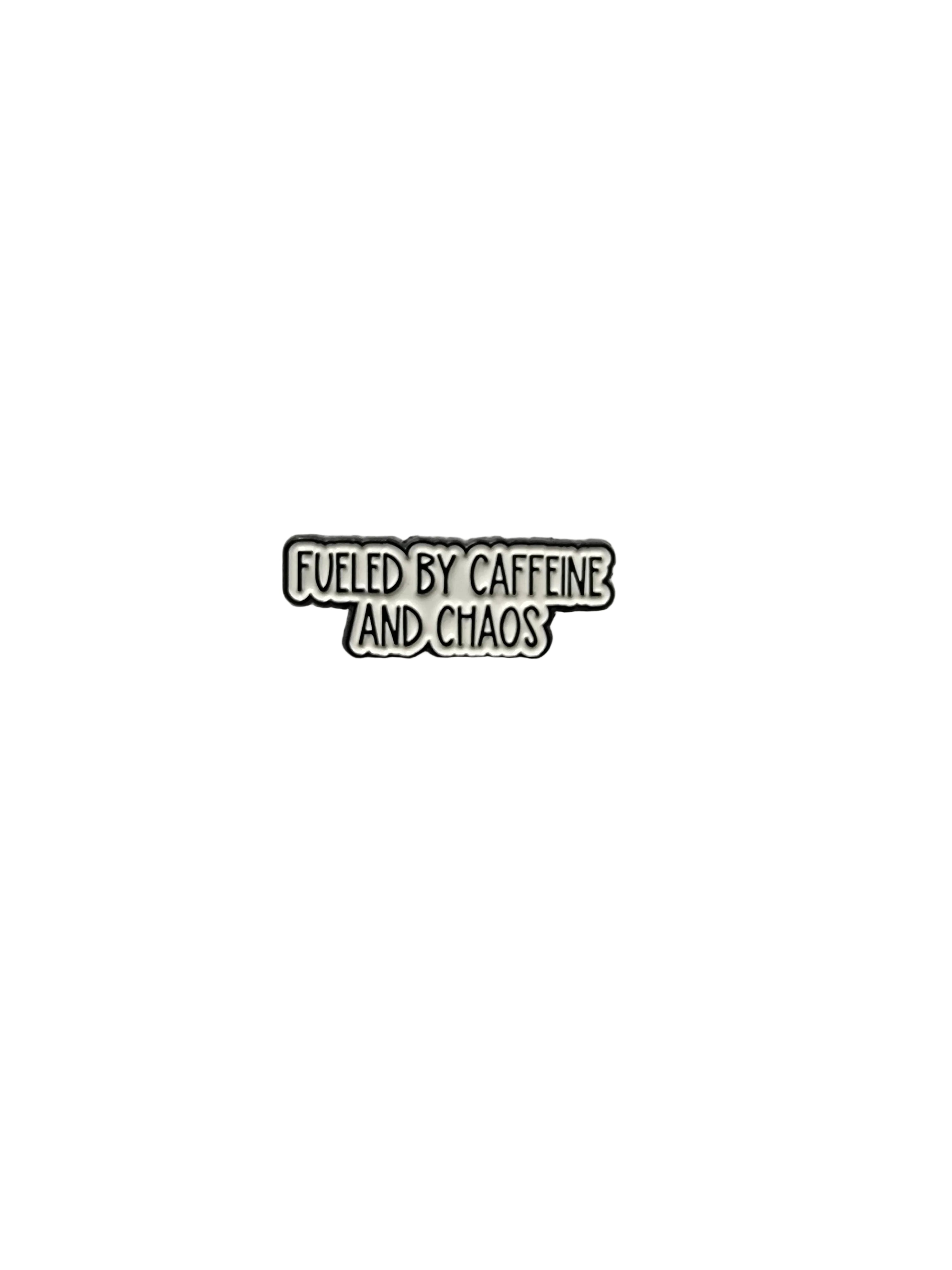 Metallic badge with text 'Fueled by caffeine and chaos' on a white background