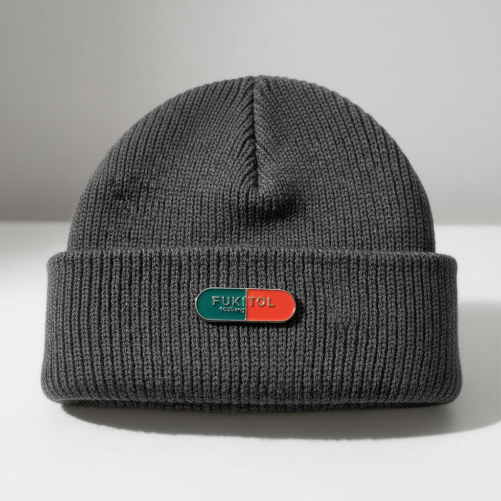 Fukitol enamel pin worn on beanie hat alternative enamel pin for casual outfits and street wear