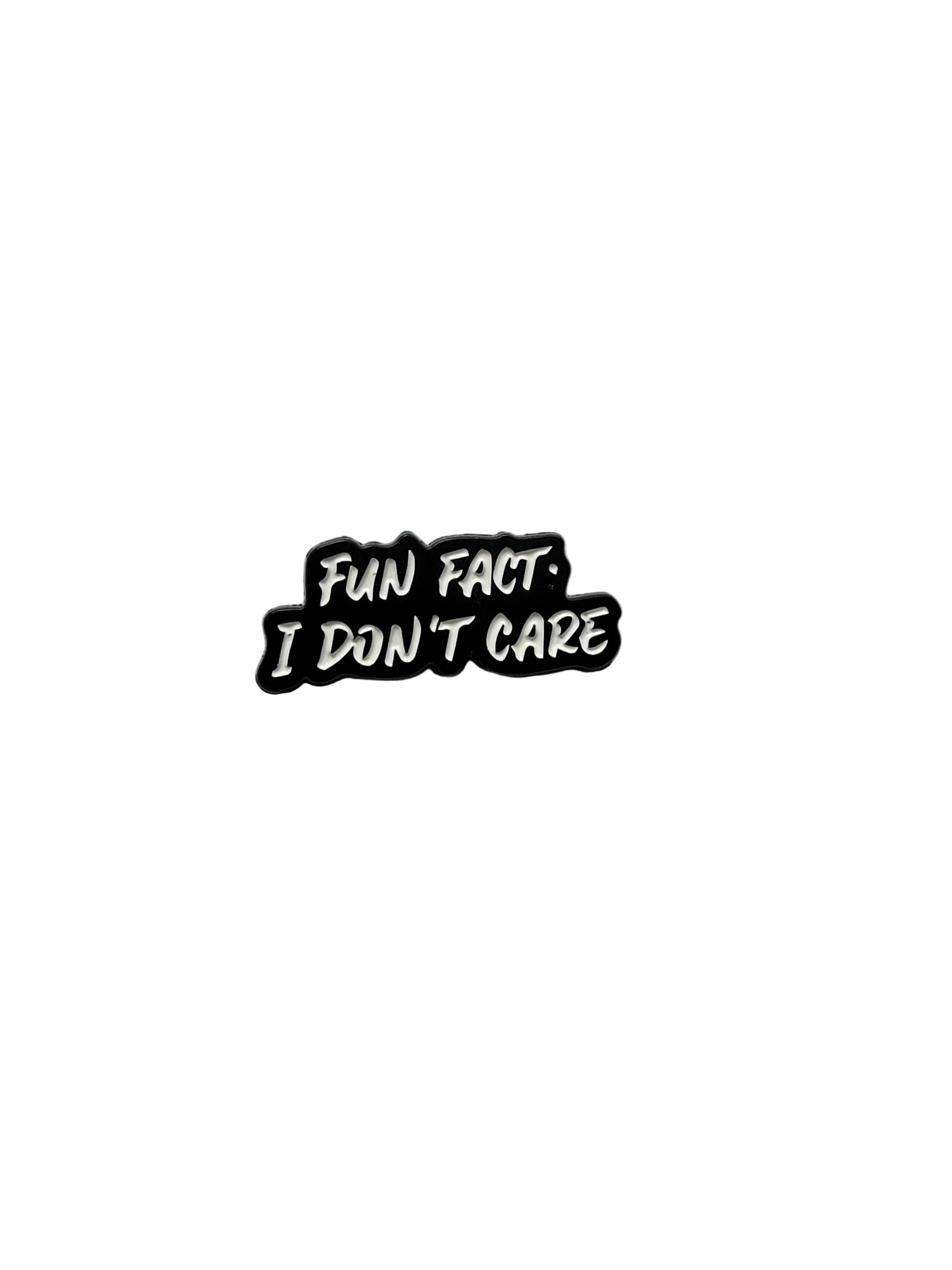 Black and white enamel pin with text on a gray background