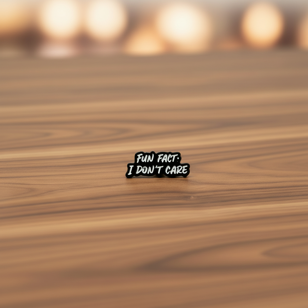 Fun Fact enamel pin on wood background funny enamel pin with black and white text detail