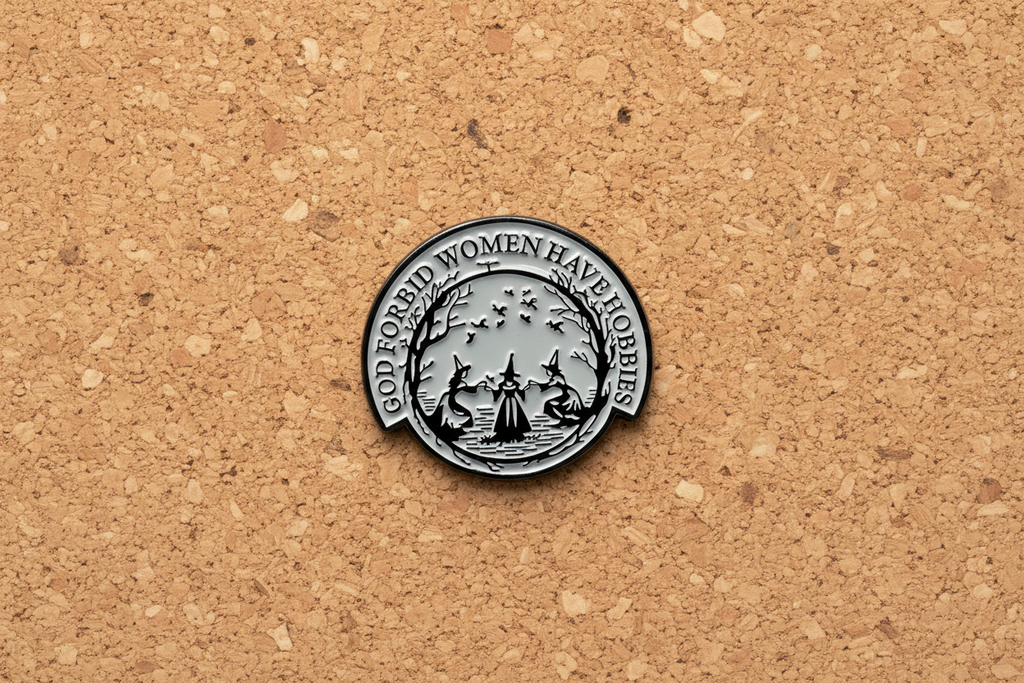 God forbid women have hobbies enamel pin displayed on cork board goth enamel pin for collectors and display