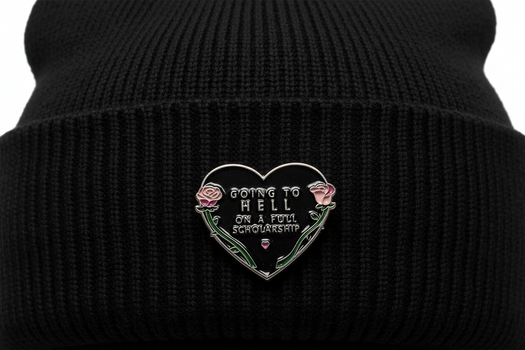 Going To Hell Enamel Pin worn on beanie hat alternative enamel pin for casual outfits and street wear