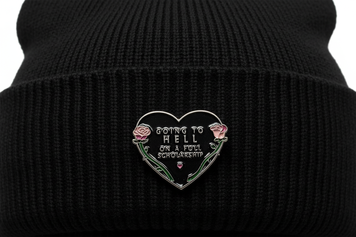 Going To Hell Enamel Pin worn on beanie hat alternative enamel pin for casual outfits and street wear