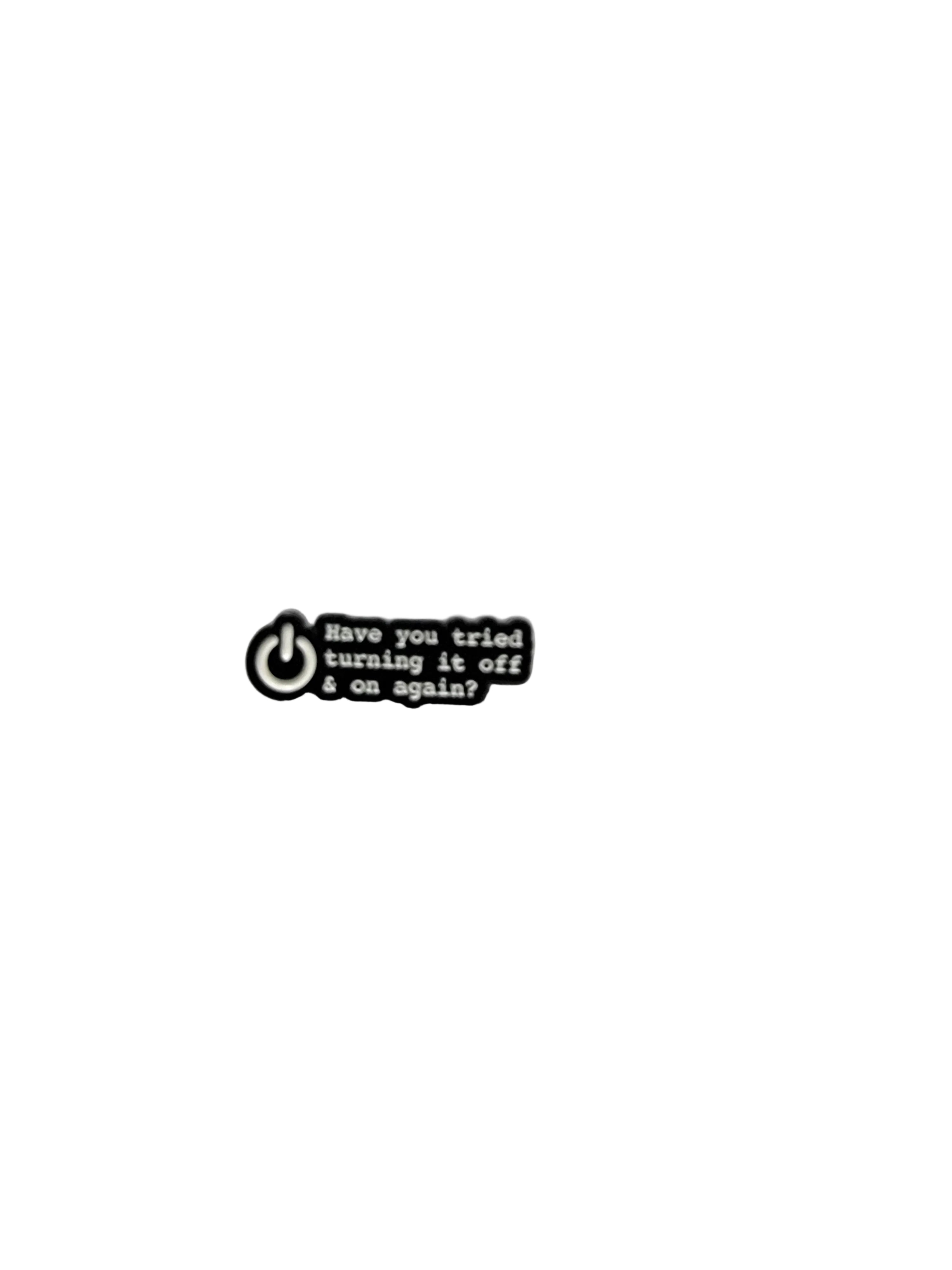 Small black and white tag with text on a gray background
