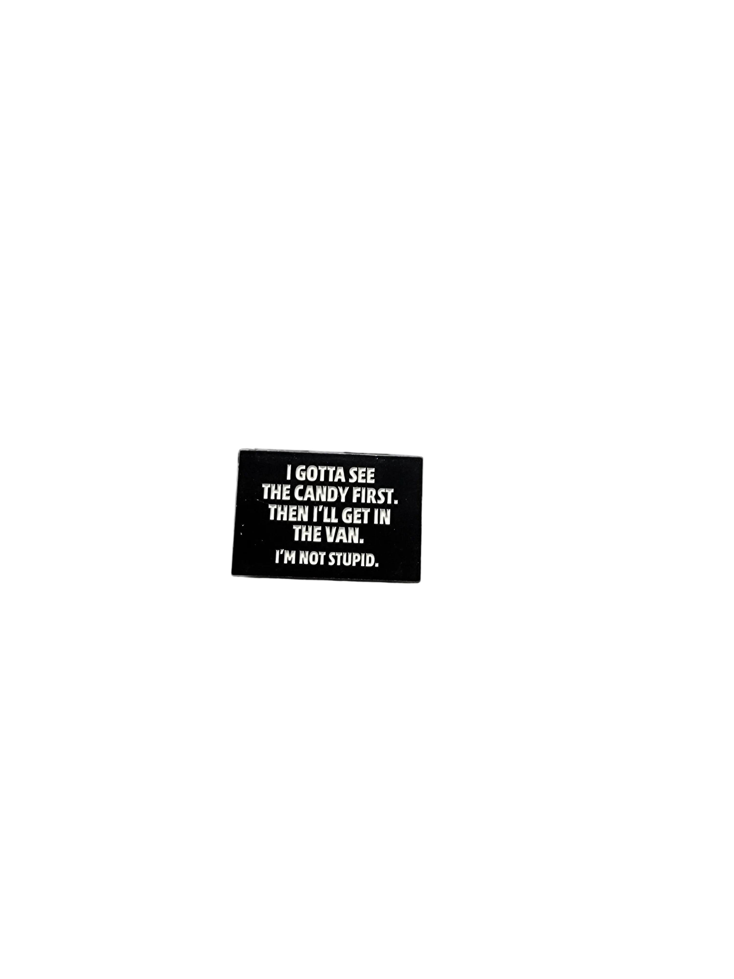 I Gotta See The Candy First Enamel Pin featuring white text design, funny gift for jackets and bags 