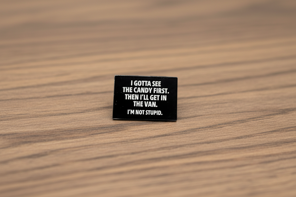 I Gotta See The Candy First Enamel Pin on wood background funny enamel pin with white text detail