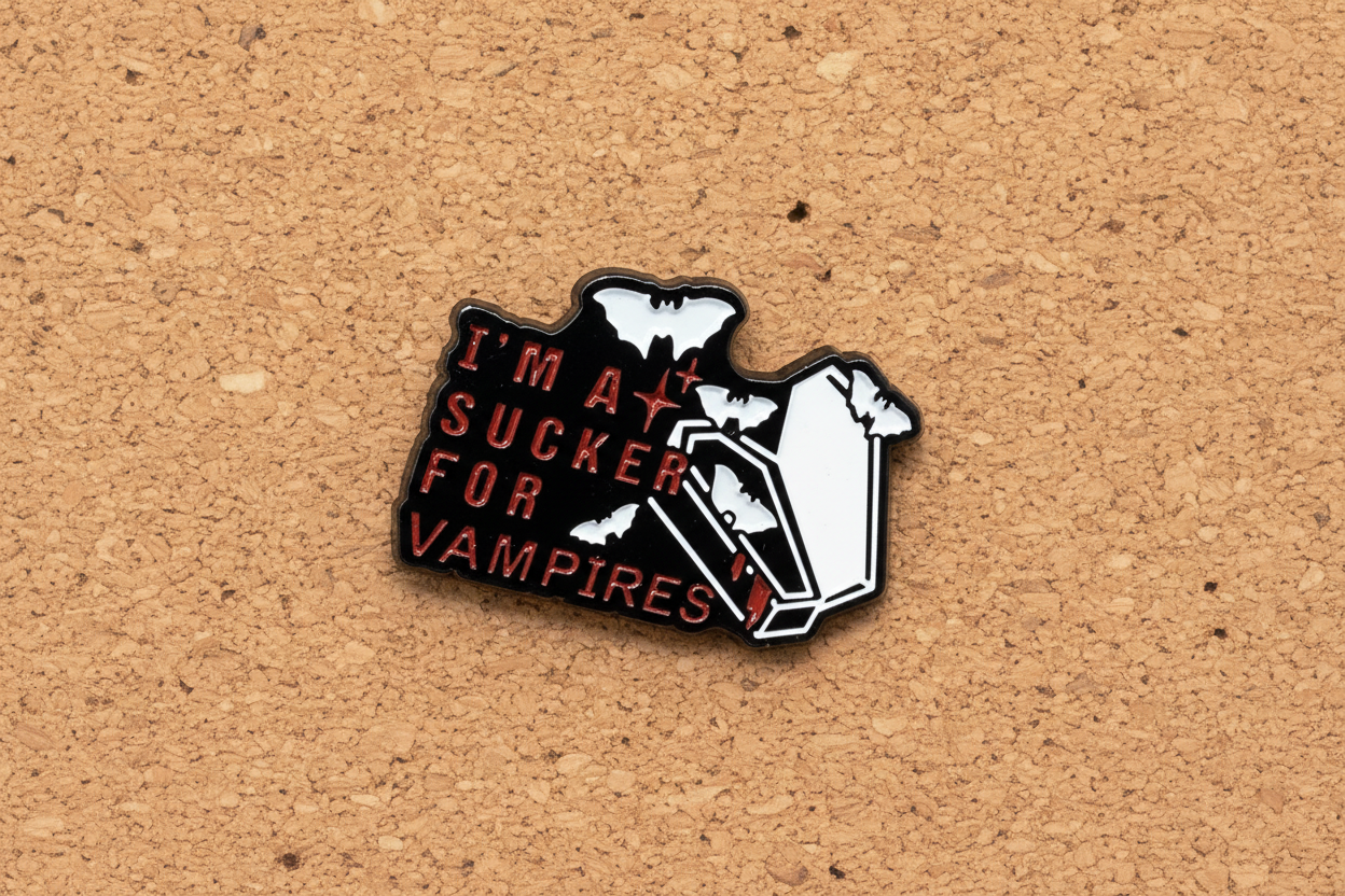 I'm a sucker for vampires enamel pin displayed on cork board gothic enamel pin for collectors and display