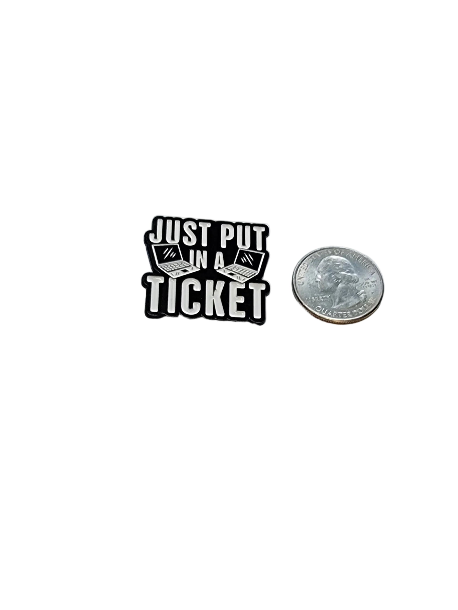 Small black and white enamel pin labeled 'Just Put in a Ticket' next to a quarter on a white background