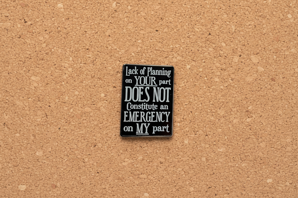 Black and white sign with funny quote on a cork background