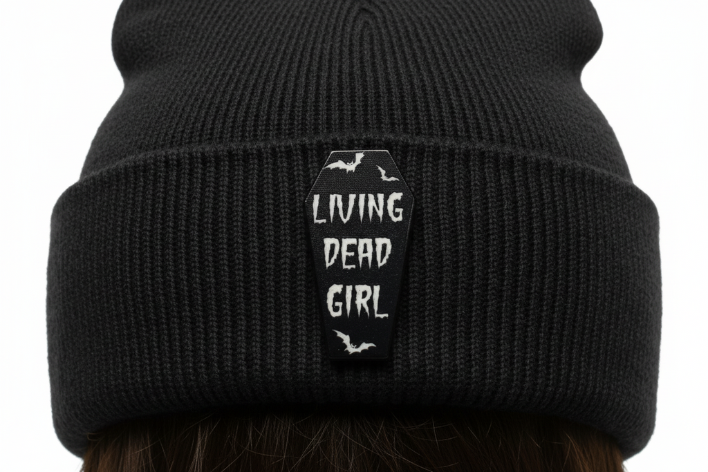 Living Dead Girl Enamel Pin worn on beanie hat alternative enamel pin for casual outfits and street wear