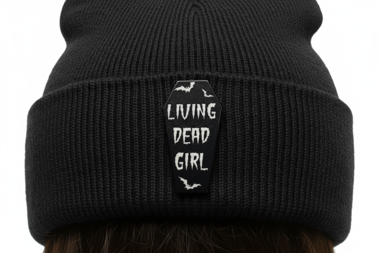 Living Dead Girl Enamel Pin worn on beanie hat alternative enamel pin for casual outfits and street wear