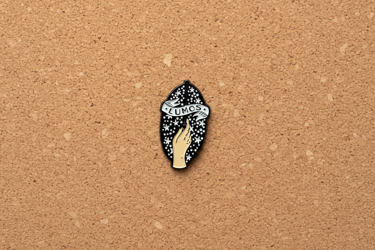 Lumos Enamel Pin displayed on cork board witch enamel pin for collectors and display