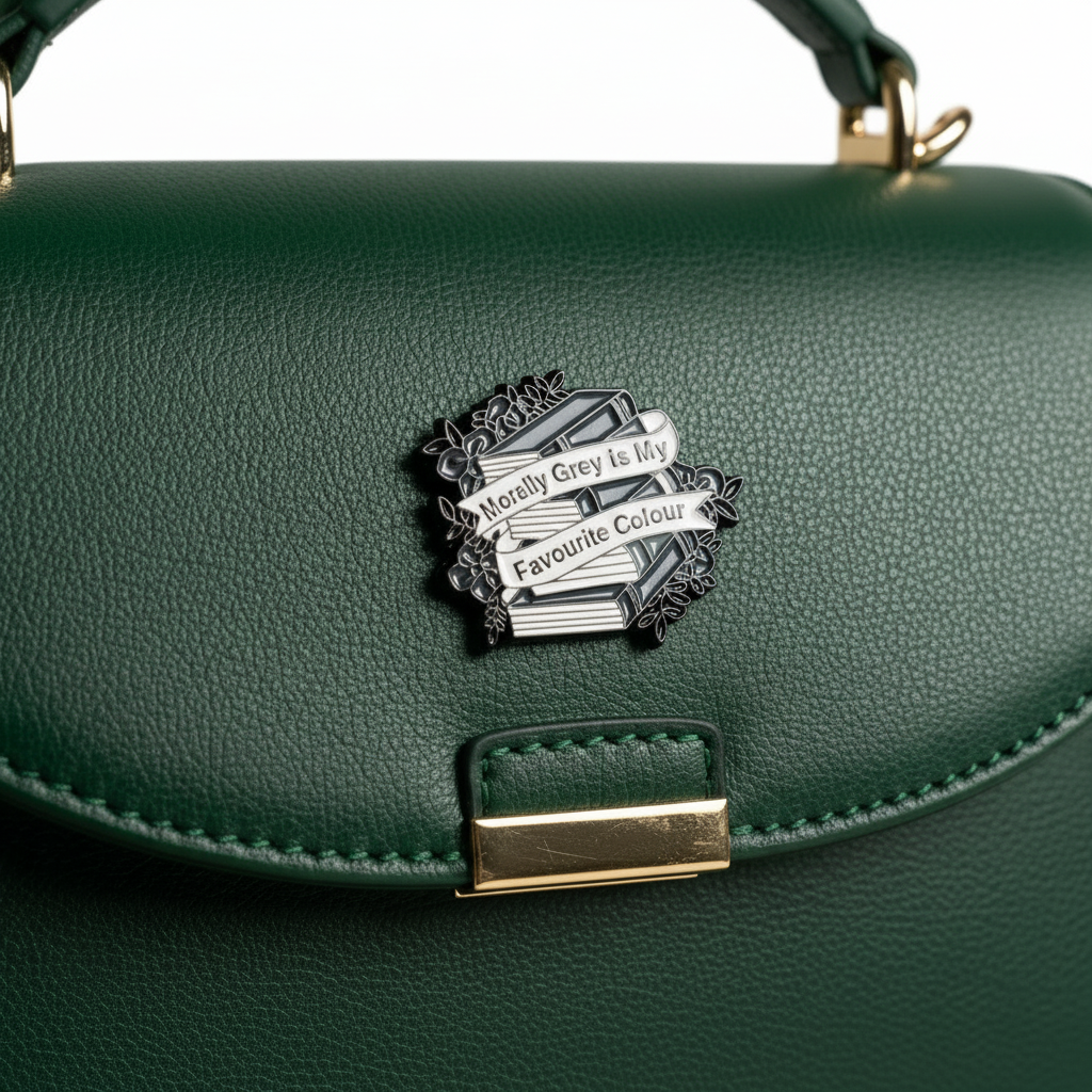 Morally grey enamel pin attached to purse bookish brooch accessory for bags and personal style