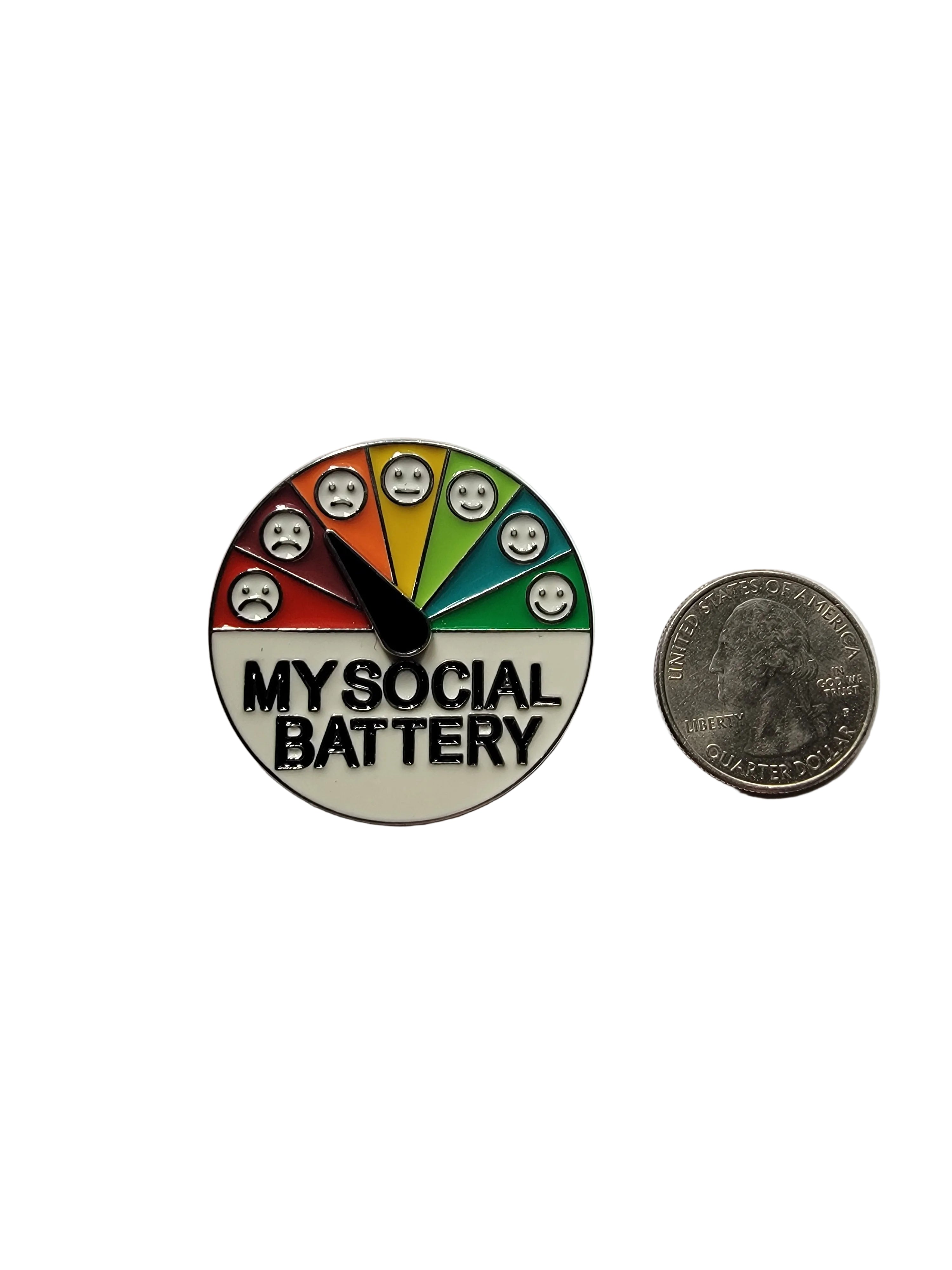 Round badge with colorful design and 'My Social Battery' text, next to a coin for size comparison on a light gray background.