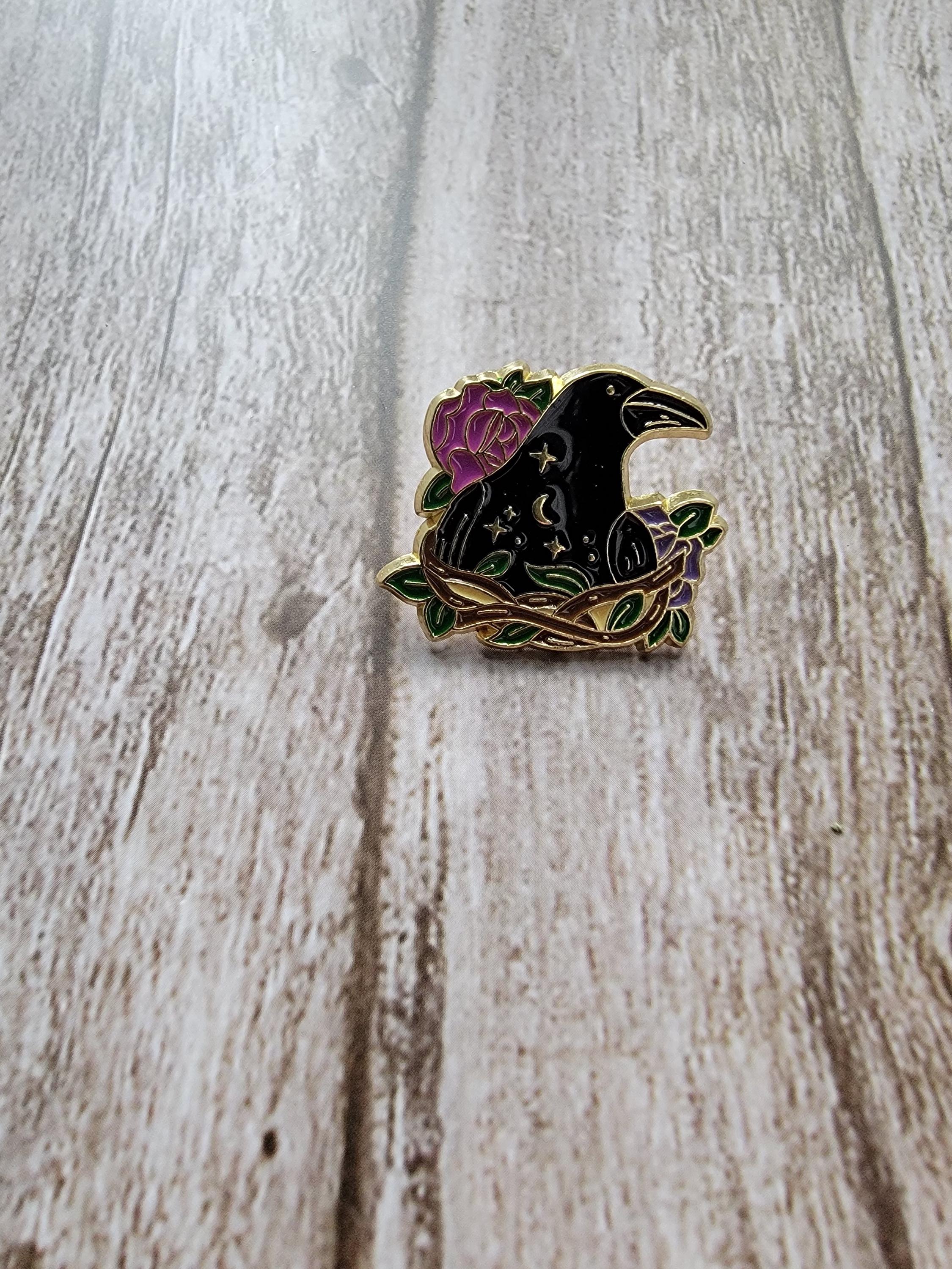 Mystical Enamel Pin on wood background witchy enamel pin with raven in a nest detail