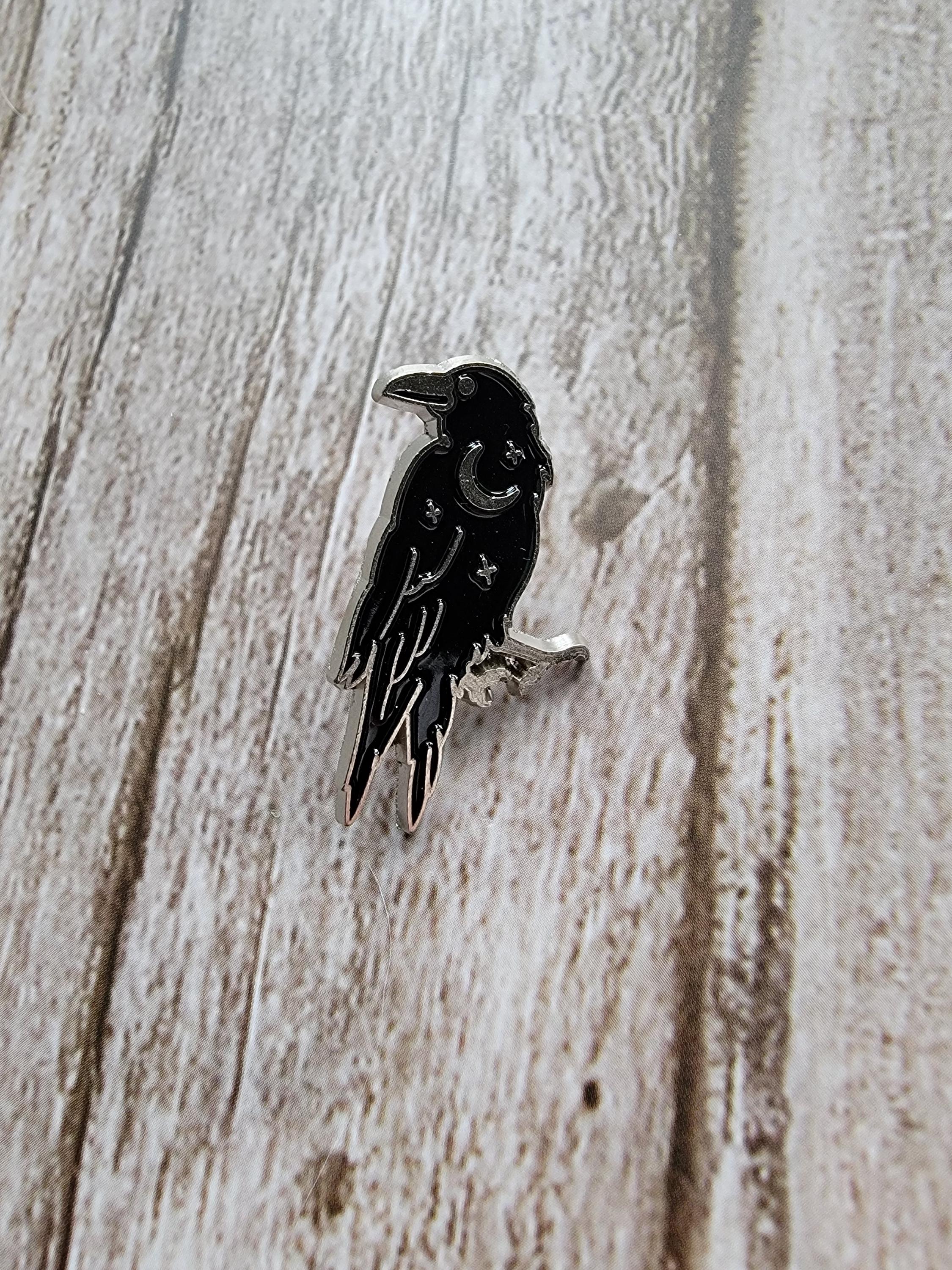 Mystical Crow Enamel Pin on wood background witchy enamel pin with silver moon and star detail