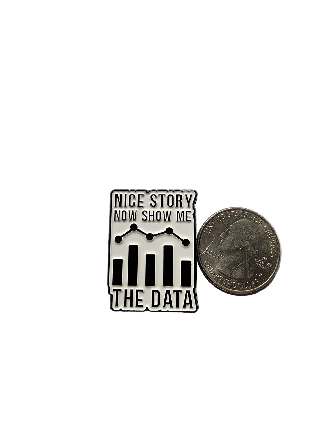 Metallic badge with text 'Nice story, now show me the data' next to a coin on a gray background