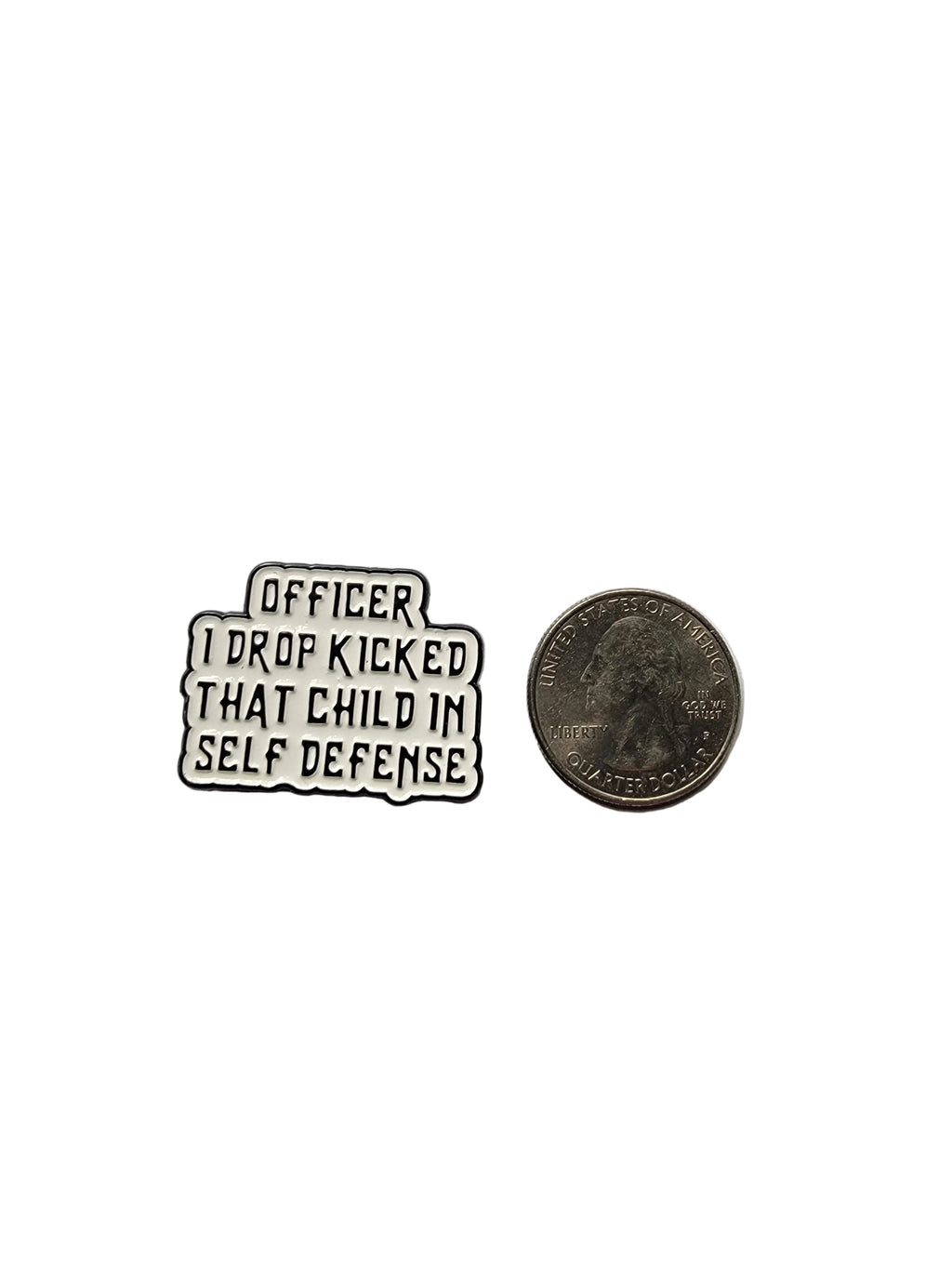 Small metal badge with text on a gray background