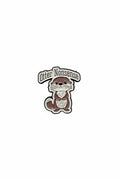 Pin with otter design and text on a gray background