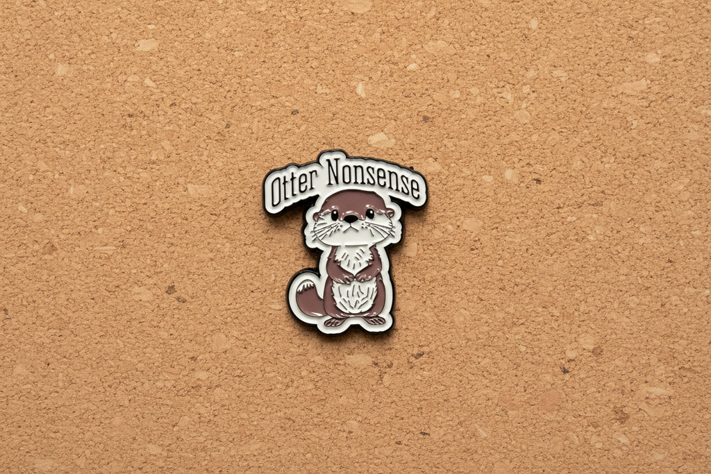 Pin with otter design and text on a cork background