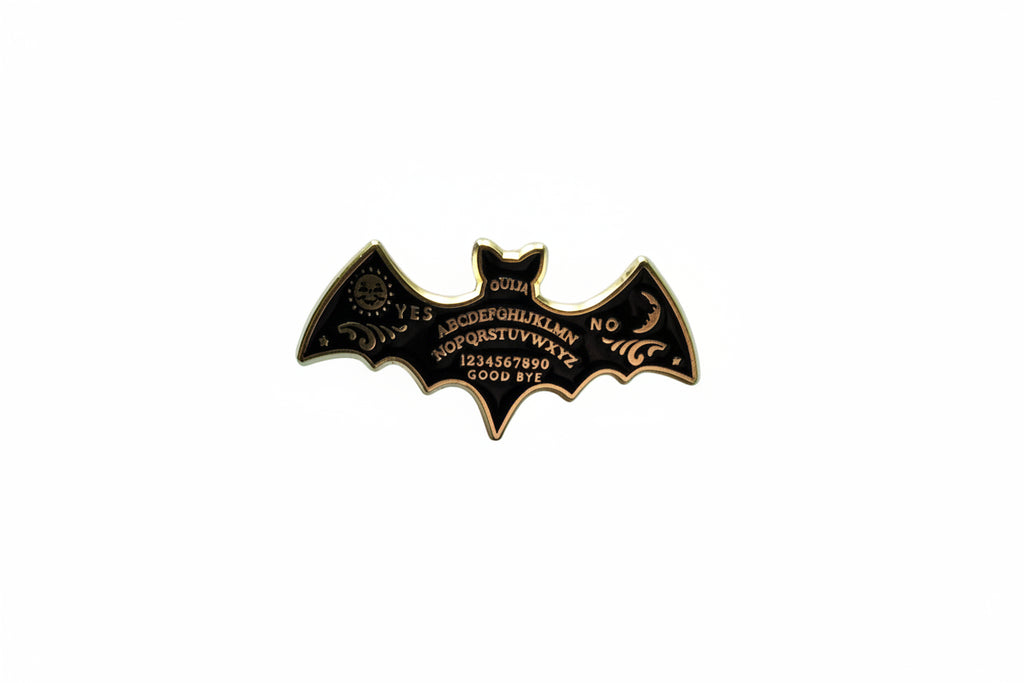Ouija board enamel pin featuring bat shape, goth gift for jackets and bags 