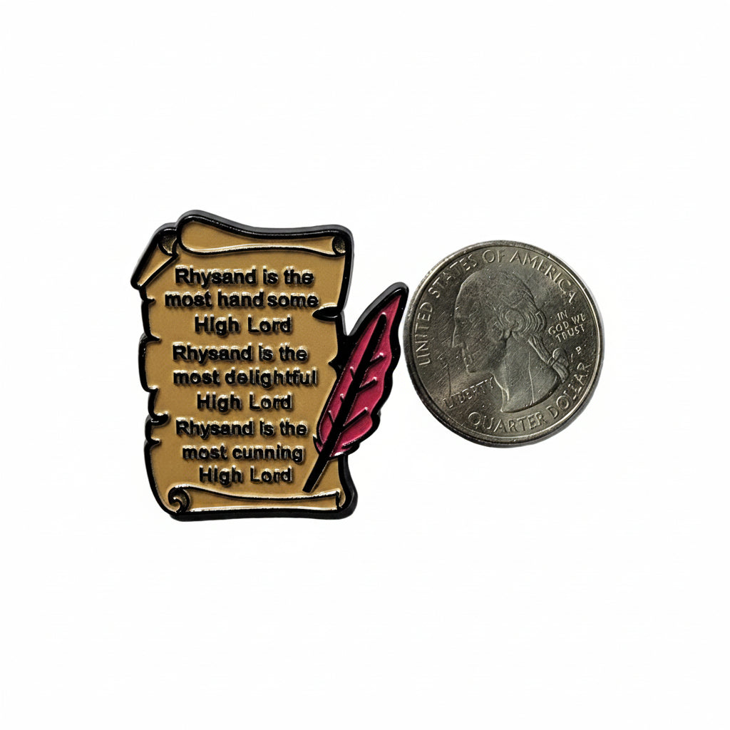 Rhysand scroll enamel shown next to quarter for size reference romantasy enamel pin dims 1.25 inches H X 1.25 