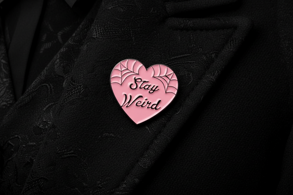 Stay Weird Enamel Pin worn on jacket lapel, goth pin style for everyday wear