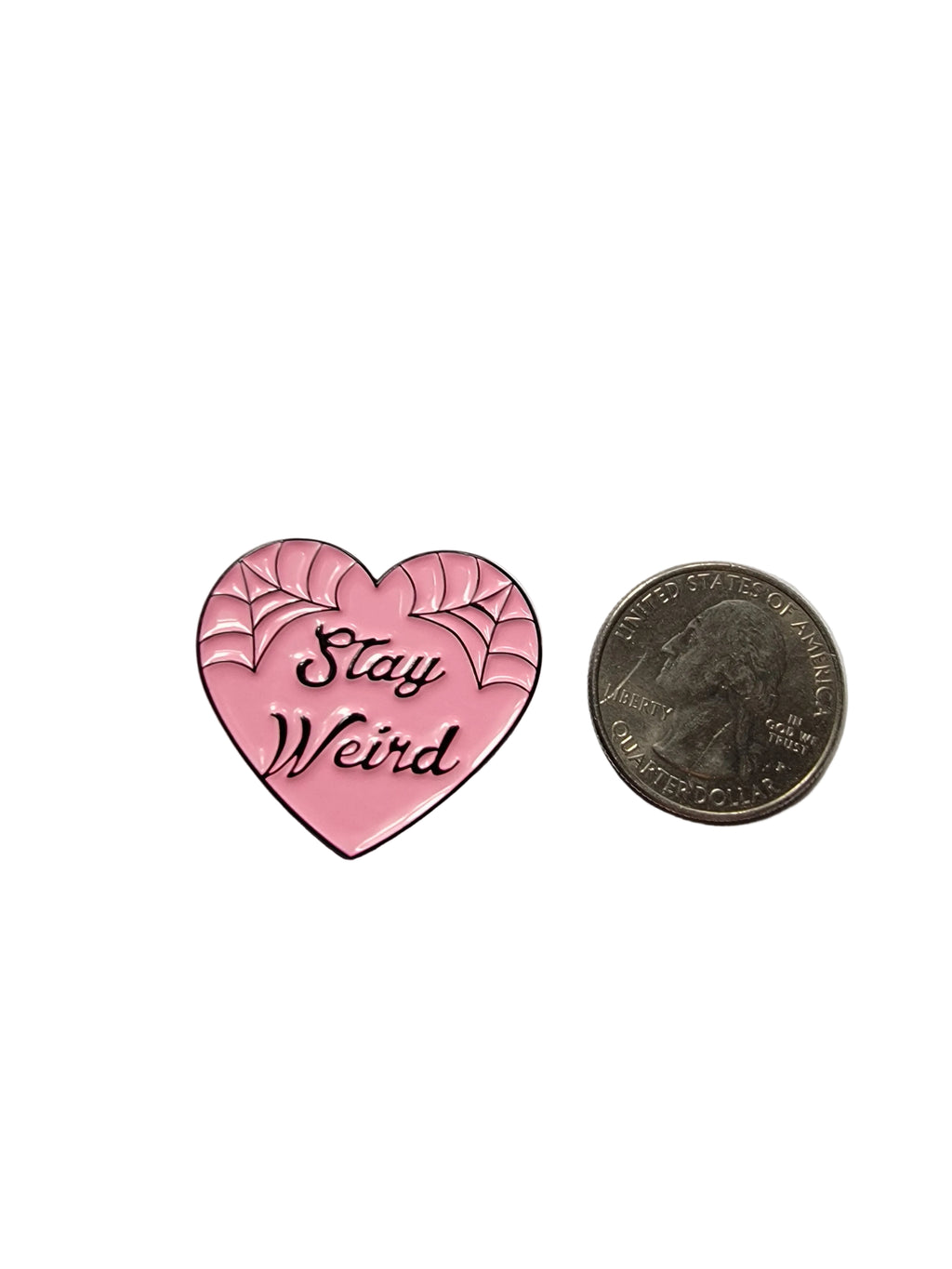 Stay Weird Enamel Pin shown next to quarter for size reference gothic enamel pin dims 1 1/4 in W x 1 1/4 in H