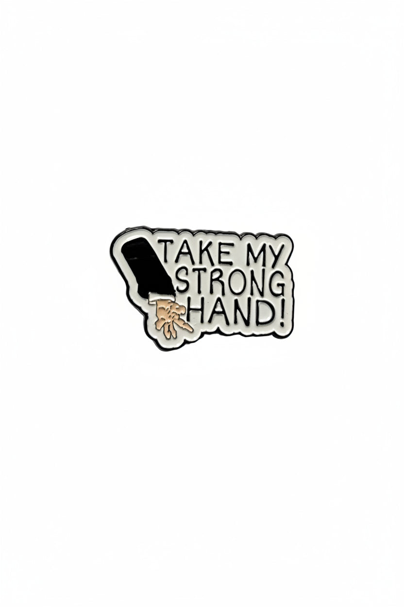 Pin with a design of a hand and text 'Take my strong hand' on a white background