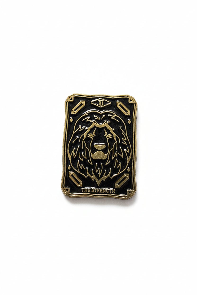 Gold lion-themed pin with 'The Strength' text on a white background