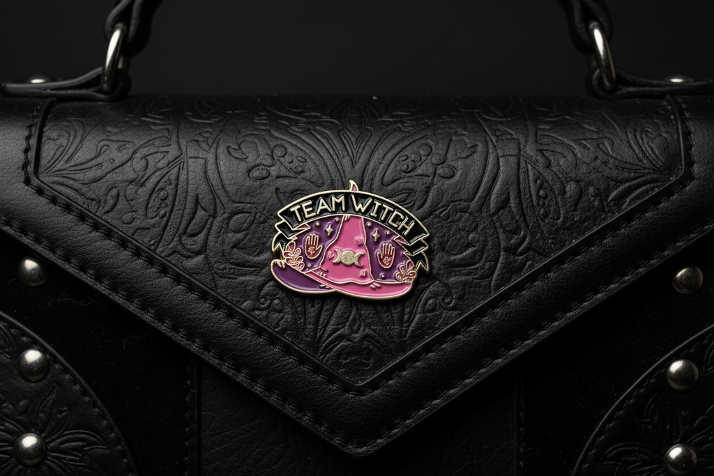 Team Witch Enamel Pin attached to purse gothic brooch accessory for bags and personal style
