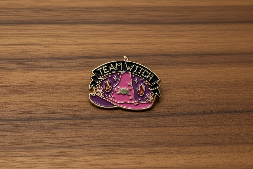 Team Witch Enamel Pin on wood background witch enamel pin with triple moon detail