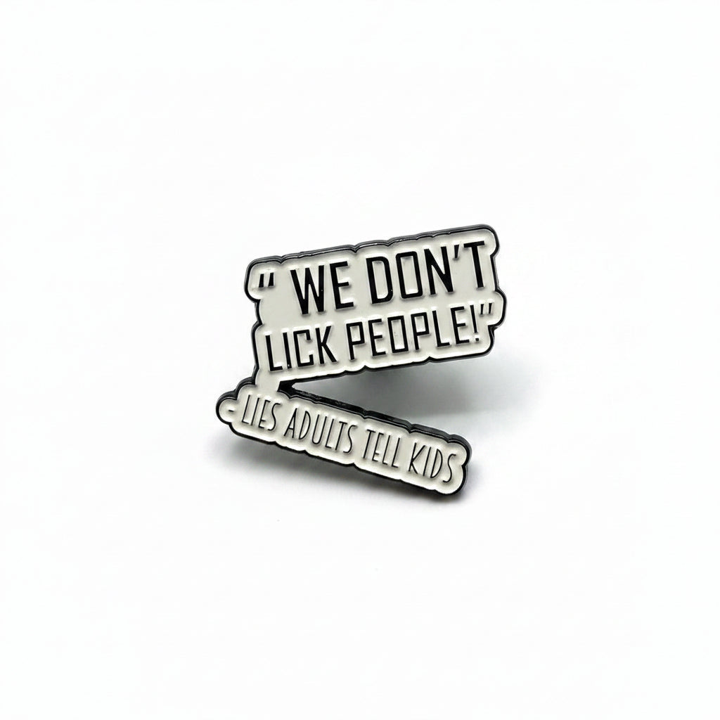 a white enamel pin with black text that says we don't lick people lies adults tell kids on a white background