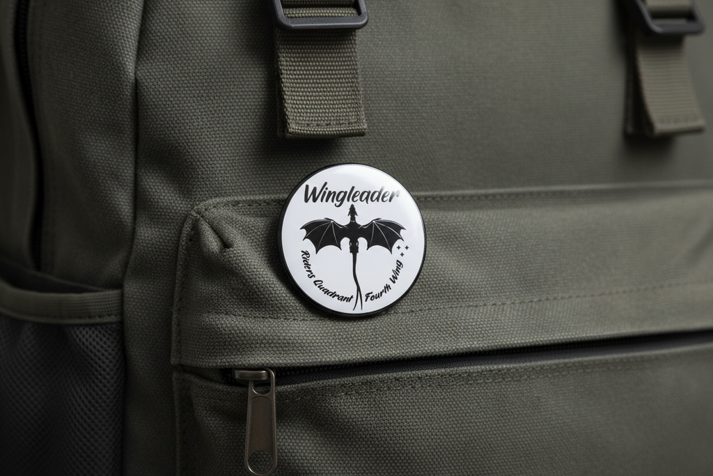 white round pin with black lettering and black dragon on it