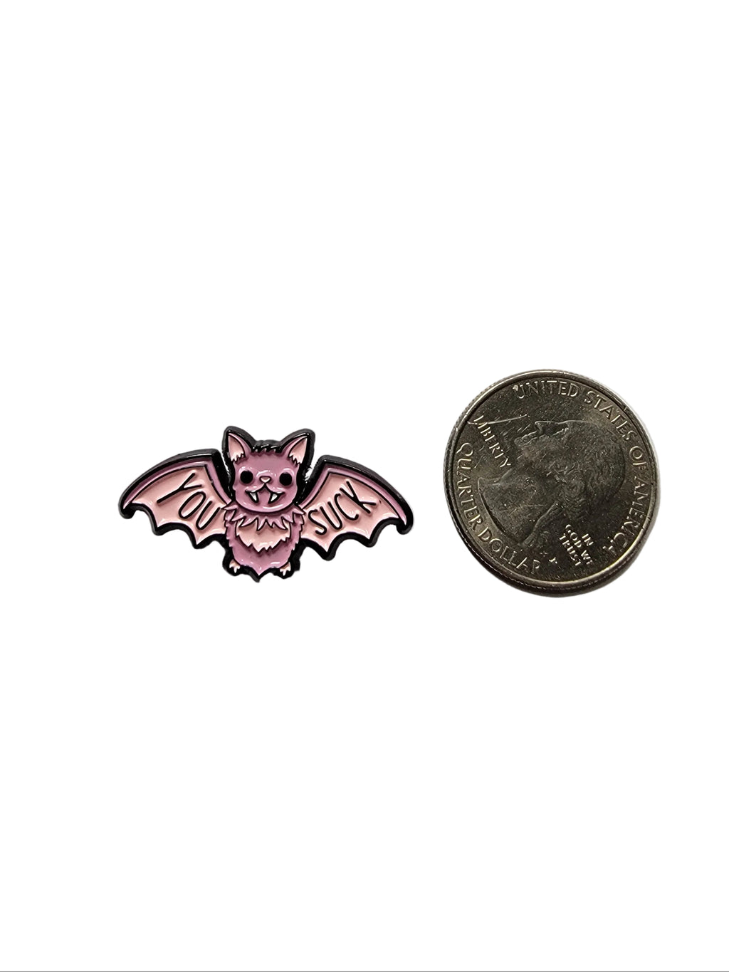 You Suck Enamel Pin shown next to quarter for size reference alt enamel pin dims 1 1/4 in W x 1/2 in H