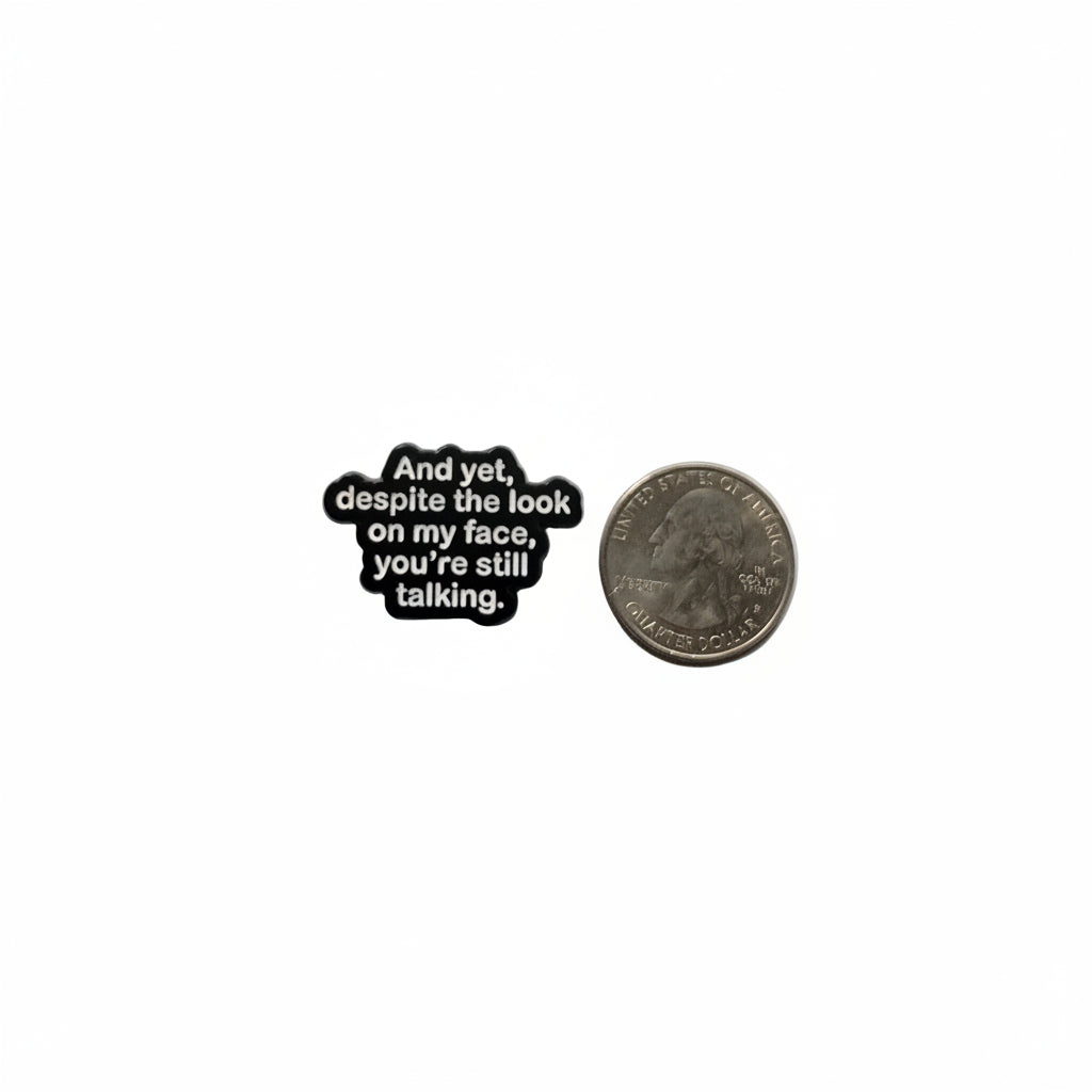 And yet despite the look on my face enamel pin shown next to quarter for size reference sarcastic enamel pin dims 1 in W x 1/2 in H
