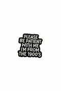 Black and white pin with text on a gray background