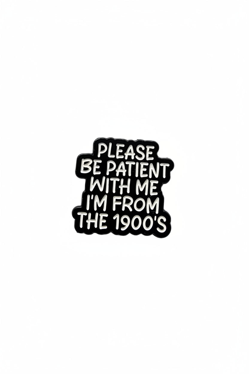Black and white pin with text on a gray background