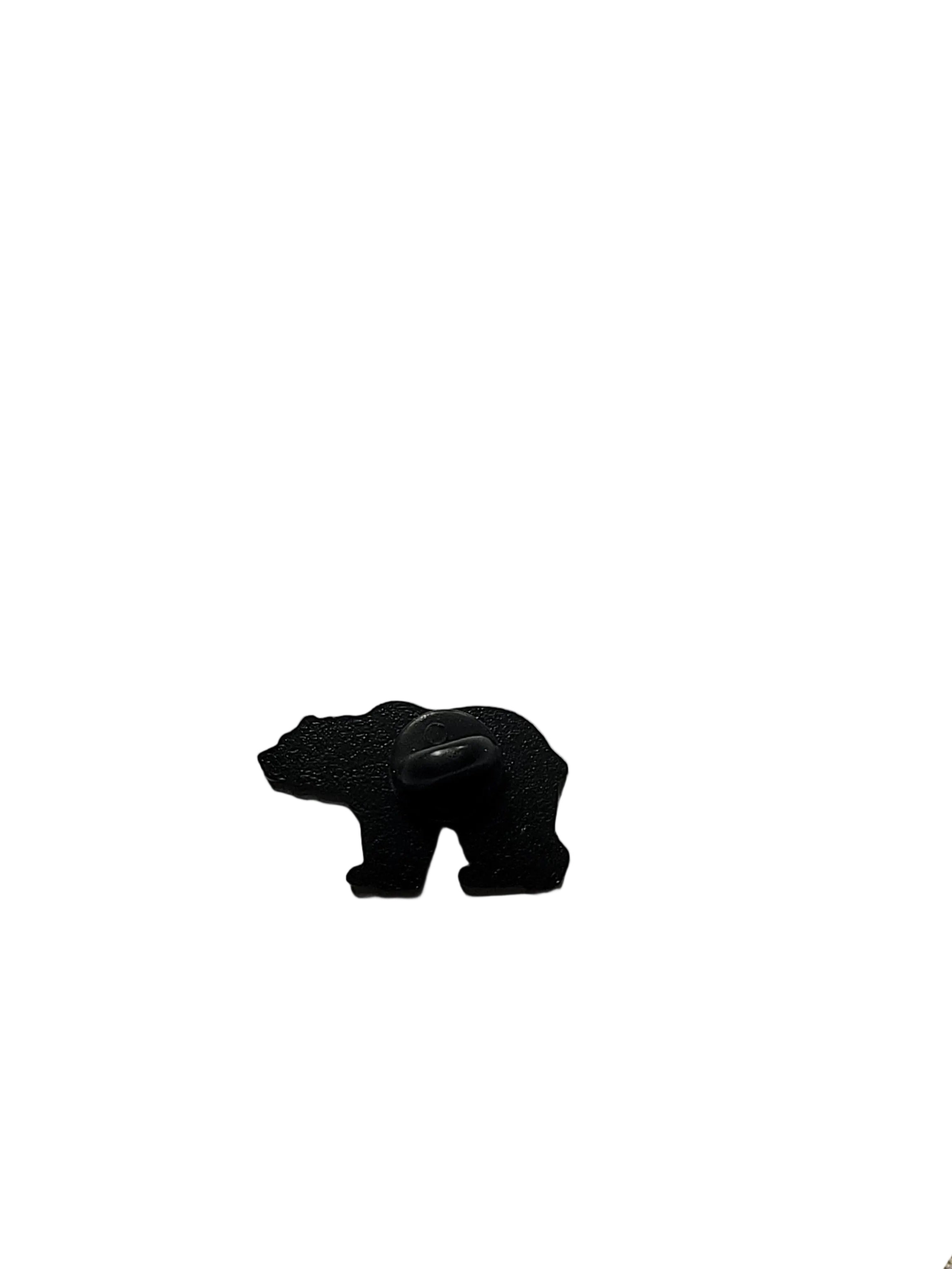 Small black plastic piece on a white background 